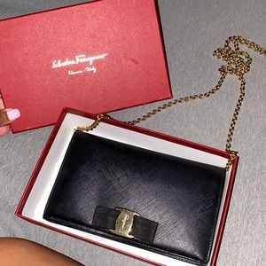 Salvatore Ferragamo Cross Body Bag in Black.